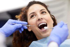 dentist pulling healthy teeth to avoid tooth crowding image